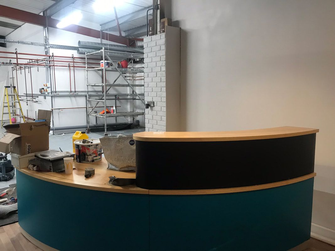 Inside the Puffin Cleaners shop and front counter on Artillery Road, Yeovil